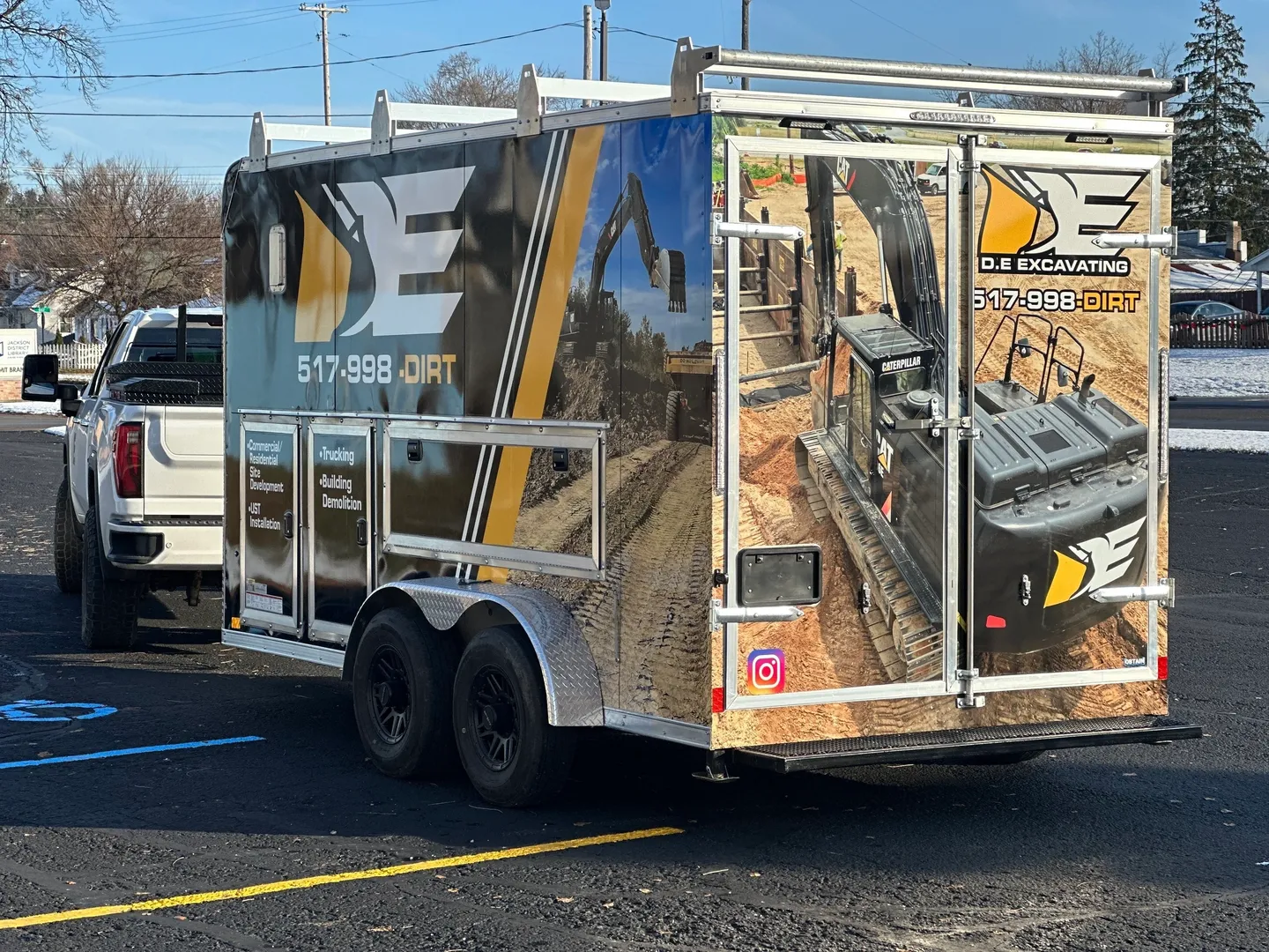 A trailer with a picture of construction on it.